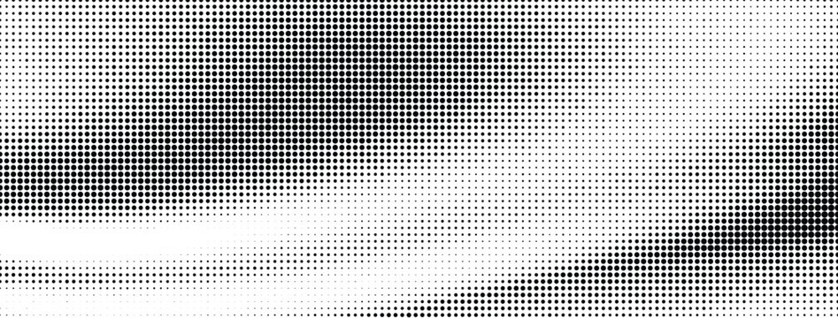 Abstract halftone pattern background with black dots of varying sizes