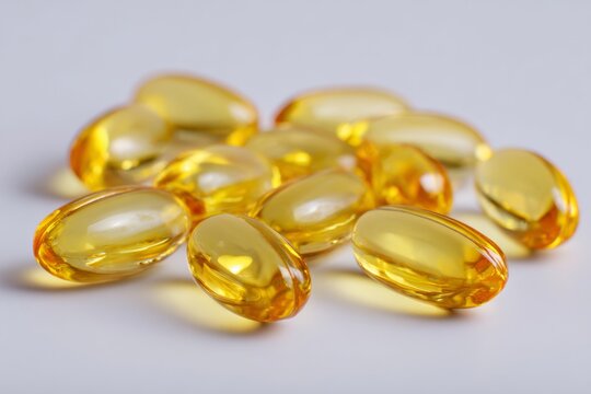 Yellow softgel capsules for health and nutrition supplements