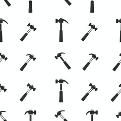 Obraz premium A repeating pattern of black claw hammers on a white background