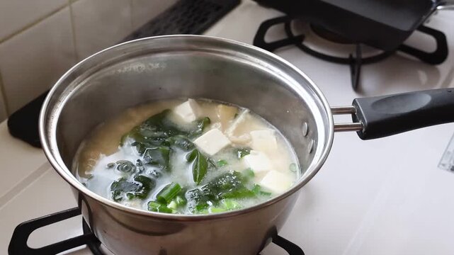Healthy Japanese Miso Soup with Tofu and Seaweed on Stove