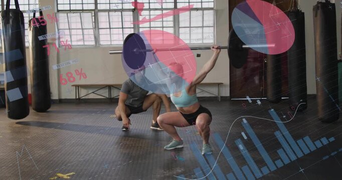 Woman lifter starting overhead squat holding bar coach spotting graphs tracking form for fitness