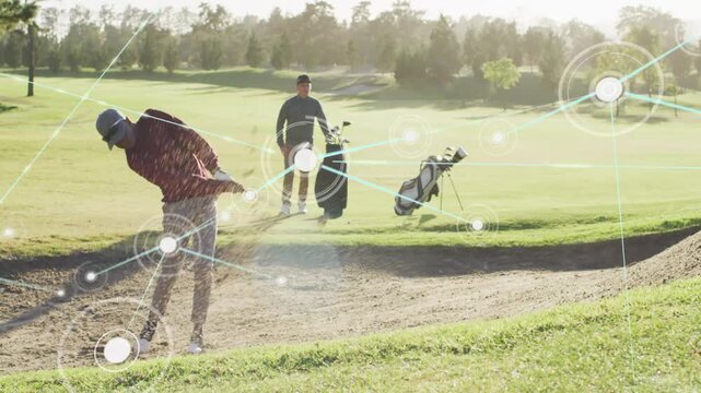 Golfer starting swing in bunker, sand lifting ball, HUD tracing arc to fairway partner watching bag