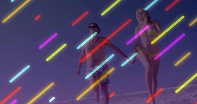 Couple running hand-in-hand toward lens on sand neon overlay onset obscuring for travel