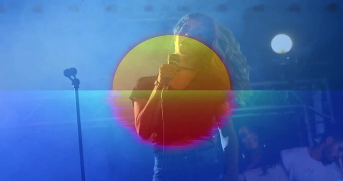 Sun circle and glitch overlay flickering over lead singer, leaning into mic and singing live music