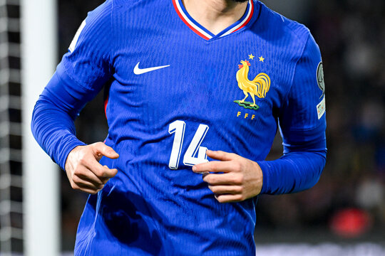 Illustration with the blue jersey of a unrecognizable French football player wearing the rooster emblem. French football national team in competition.	
