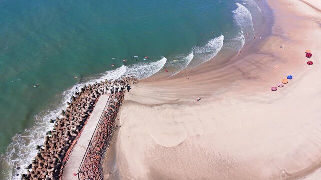Exploring Phan Thiet, Binh Thuan, Vietnam from a drone view, showing beach and water activities.