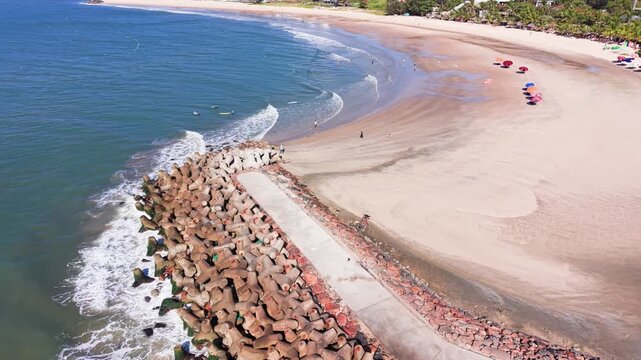 Explore Phan Thiết, B&igrave;nh Thuận with a drone view of the beach and rocky area.