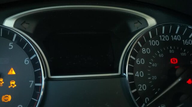 A clear, close-up shot of a vehicle's instrument cluster featuring a digital central display with a "Loose Fuel Cap" alert and accompanying icon. 