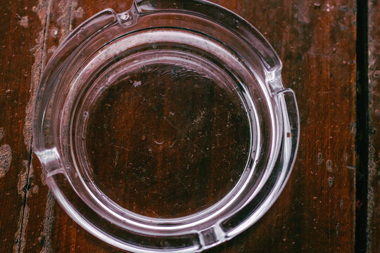 Cigarette ashtray on a wooden table