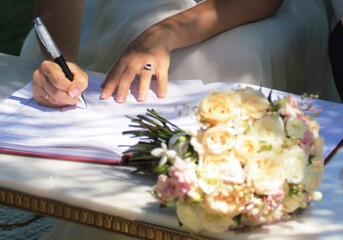 Obraz premium wedding documents being signed with flowers