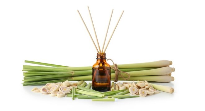 Lemongrass essential oil in glass bottle with reed diffuser sticks and fresh lemongrass stalks isolated on white background