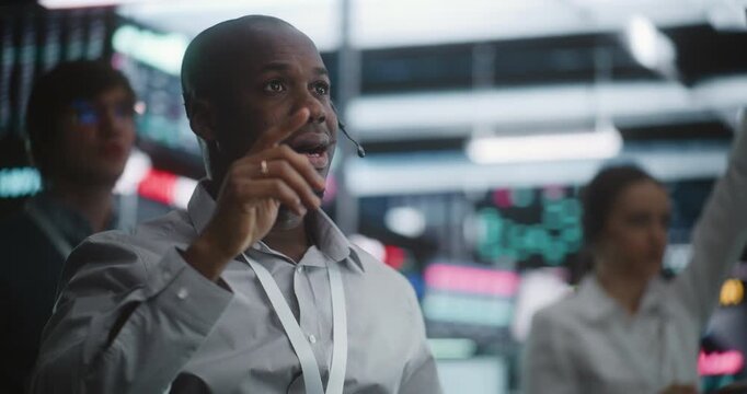 Diverse Trading Team Reacting Simultaneously to Urgent Market Shift in Exchange Pit. Three Diverse Brokers Experience Collective Reaction Raise Hands to Signal Trades. Volatile Nature of Live Trading.