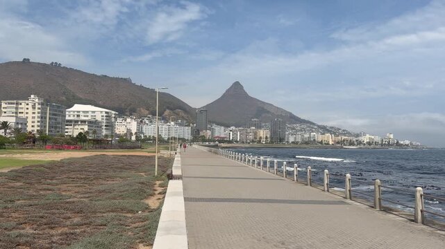 Sea Point Promenade with magnificent Sea Point and Lion&rsquo;s Head in the Background.