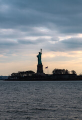 Fototapeta premium Statue of Liberty symbol of freedom. Statue of Liberty iconic American landmark. Statue of Liberty national heritage monument. Statue of Liberty travel destination.