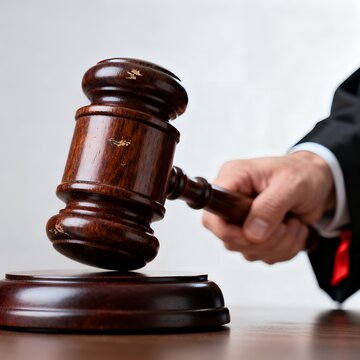 Judge Striking Gavel Over Sound Block to Announce Courtroom Decision