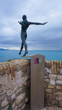 Antibes, France - March 10, 2026: Sculpture named Le Defi or The Challenge in the walls in the old town. The art by Nicolas Lavarenne is aligned with the horizon, creating a beautiful visual effect.