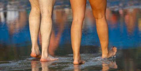 Fototapeta premium Two people are standing in the water