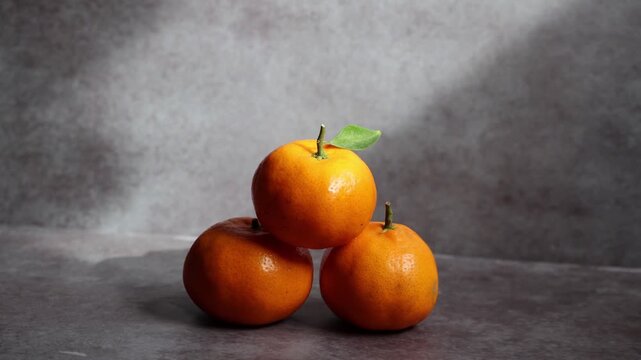 Footage of Sunkist lime exposed to sunlight on a gray background perfect for advertising and creative design