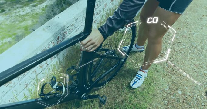 Animation of chemical structures over caucasian female cyclist repairing her bike