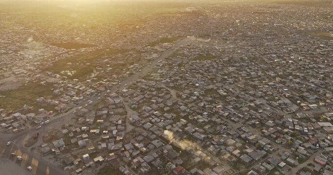 Cape Town South Africa Aerial v102 birds eye view flyover Baden Powell Dr capturing views of Khayelitsha Township and Japhta K Masemola Rd at sunset - Shot with Mavic 3 Pro Cine - Jan 11th 2024