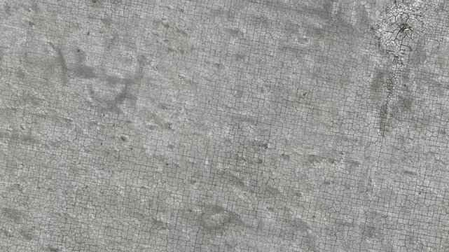 Drone perspective of dry, fractured ground, representing prolonged drought, declining soil moisture, and ecological imbalance in vulnerable landscapes.
