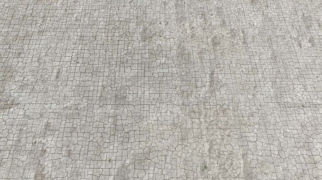 Aerial drone view of cracked dry soil forming fragmented patterns, highlighting severe drought conditions, water scarcity, and environmental stress affecting land sustainability and agriculture.
