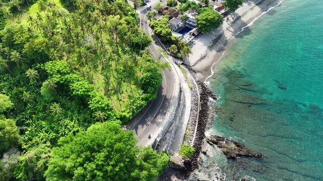 Scenic Coastal Road and Tropical Beach at Senggigi Coast in Lombok Indonesia