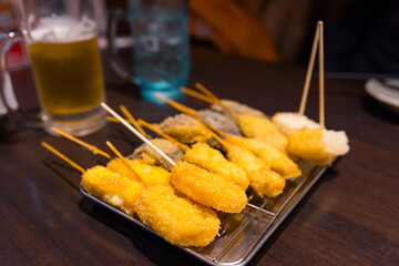 Obraz premium Japanese street food osaka kushikatsu on skewers
