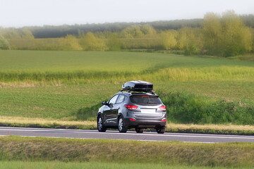 Fototapeta premium Exploring countryside by car with extra baggage space