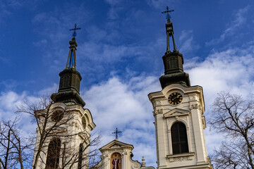 Twin Church Towers Under Bright Blue Sky © Mikhail