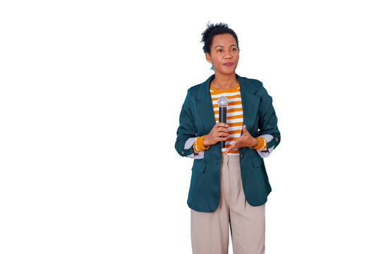 Black woman speaker presenting in a conference, holding a microphone while talking, delivering a speech