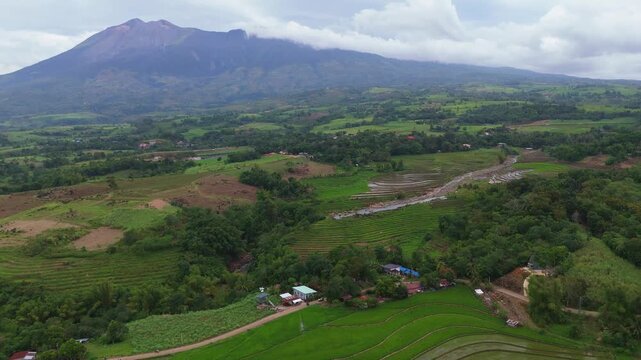 Aerial look at the lush tropical valley and hills at the base of Mount Canlaon in Canlaon City, Negros Oriental, Philippines. Fertile volcanic land and remote terrain