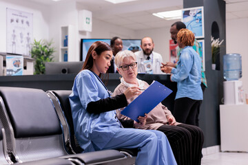 Asian gerontology physician in charge of gerontology area requesting personal data from elderly...