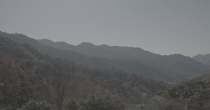 Lush Mountains Surrounded by Fiery Autumn Foliage