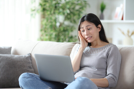 Stressed asian woman messed up after online mistake