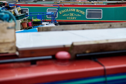 Detail of a traditional narrowboat named English Rose from Derby moored on a canal, Birmingham Canal Navigations, Birmingham, West Midlands, England, UK.