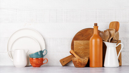 Kitchen utensils and cutting boards on table © Evgeny Karandaev