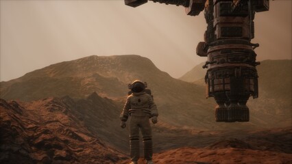 An astronaut stands in awe on the rocky surface of Mars, gazing at a towering spacecraft that looms above. © icetray