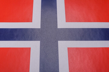 Fototapeta premium Norwegian national flag in red, blue and white color as a symbol of independence. Flag of Norway