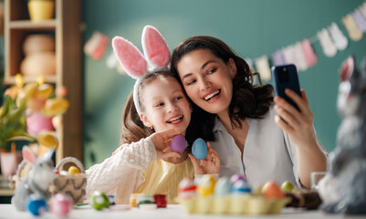 Happy Mother and Daughter Taking Easter Selfie Together While De