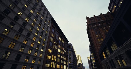 ornate brick facades lining narrow street under dusk light, historic banking architecture with detailed cornices and warm interior glow, sense of commerce © icetray