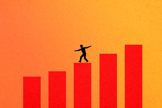 Man balancing on red chart bars illustrating investment risk