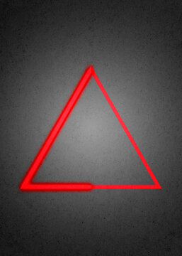 Red glowing geometric triangle illustration on textured background