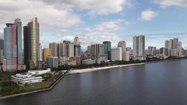 Aerial view of manila baywalk dolomite beach and modern city skyline