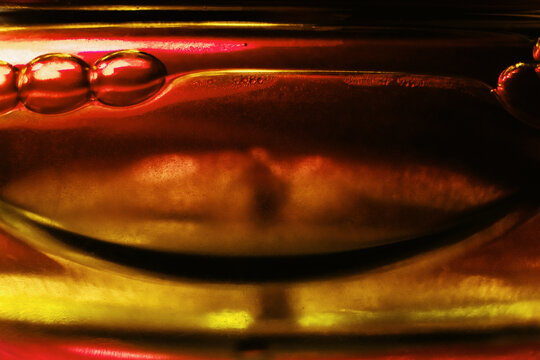 Abstract colorful liquid bubbles macro close up with reflection