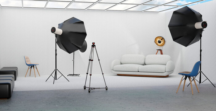 Modern indoor studio with photographic lighting equipment and sofa