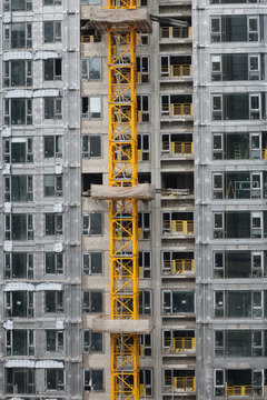 Vertical image of the construction process of a multi-story building