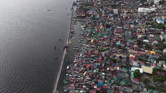 Aerial view of a densely populated coastal slum in the philippines