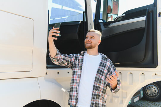 Truck driver filming video outdoors with smartphone
