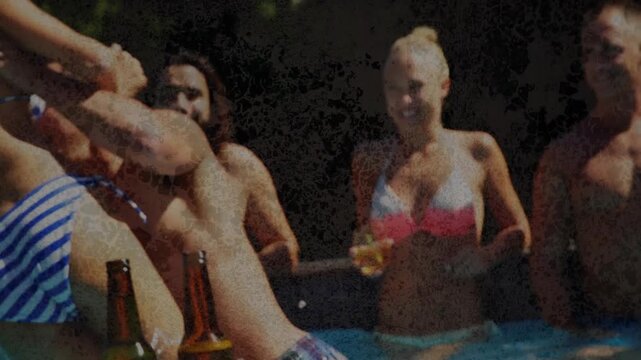 Friends filming social content, man lifting woman playfully, losing balance, splashing beer bottles